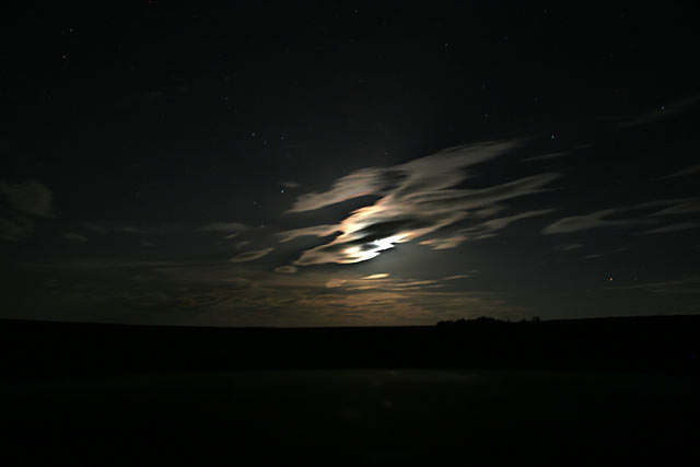 bank of clouds covering the moon